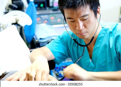 An Asian Doctor Working In A Hospital