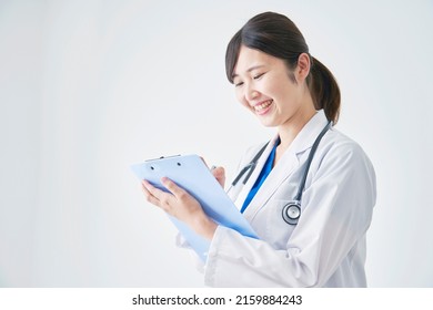 Asian Doctor Writing In White Background