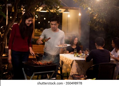 Asian Are Doing Barbecues And Party At Night