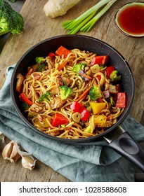 Asian Egg Noodles With Vegetables And Meat On Cooking Pan