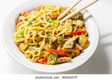 Asian Egg Noodles With Vegetables, Mushrooms, Green Onions And Sesame