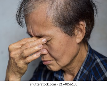 Asian Elder Man Massaging His Eye. Concept Of Eye Pain, Strain Or Itchy Eyelid.