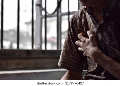 Asian Elder Man Suffering From Right Sided Chest Pain. Chest Pain Can Be Caused By Heart Attack, Myocardial Infarct Or Ischemia, Myocarditis, Pneumonia, Stress, Etc.