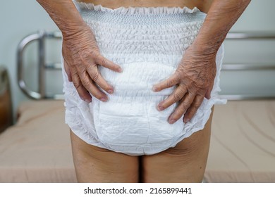 Asian Elder Senior Woman Patient Wearing Adult Incontinence Diaper Pad In Hospital.