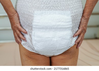 Asian Elder Senior Woman Patient Wearing Adult Incontinence Diaper Pad In Hospital.