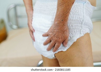 Asian Elder Senior Woman Patient Wearing Adult Incontinence Diaper Pad In Hospital.