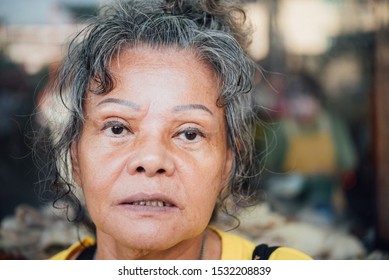 Asian Elder Woman 60s With Black Hair And Wrinkled On Face Show Her Eyes And Eyebrow Tattoo Before Cornea Surgery, Beauty And Healthcare Concept