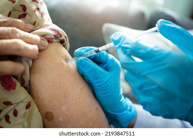 Asian Elder Woman Having A Vaccination At Hospital By Doctor. Flu And Influenza Vaccination To Protect From Critical Illness And Generate The Immunity.