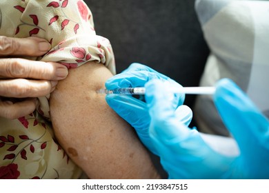 Asian Elder Woman Having A Vaccination At Hospital By Doctor. Flu And Influenza Vaccination To Protect From Critical Illness And Generate The Immunity.