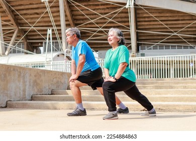 Asian elderly couple exercising outdoors together. Sports concept. health care in retirement - Powered by Shutterstock