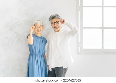 Asian elderly couple with glasses. Eyewear.