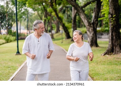 Asian Elderly Couple Jogging Or Exercise In The City Park, Retirement Leisure Activities, Life Insurance, And Health Care In Old Age Concept.