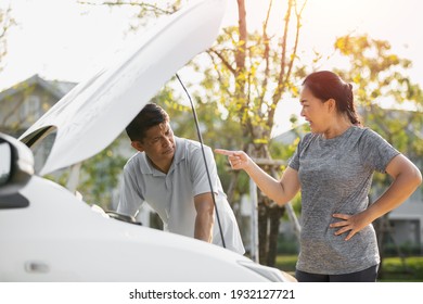 Asian Elderly Husband And Wife Couples Lose Temper Broken Car Have A Problem On The Road. Man Trying Fix Their Car With Woman Scolding Reproach.