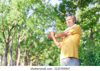 Asian elderly man exercising in the park