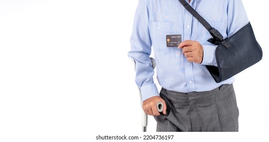 Asian Elderly Man With Hat Broken Arm Wear Arm Splint For Treatment And Smiling And Holding Credit Card For Confident Lifestyle, Old Elderly Male Payment Credit Card Medical Care.