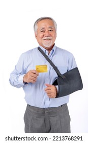 Asian Elderly Man With Hat Broken Arm Wear Arm Splint For Treatment And Smiling And Holding Credit Card For Confident Lifestyle, Old Elderly Male Payment Credit Card Medical Care.