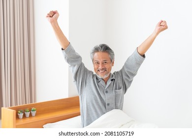 Asian Elderly Man In Night Clothes In Bed,Smile