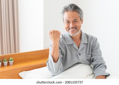 Asian Elderly Man In Night Clothes In Bed,Smile