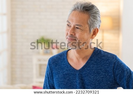 Asian elderly man relaxing in the room