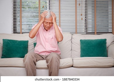 Asian Elderly Men Have Headaches Accumulated Stress Due To Being Indoors During The Coronavirus 2019. Concept Of Physical And Mental Health Problems Of The Elderly In Retirement Age