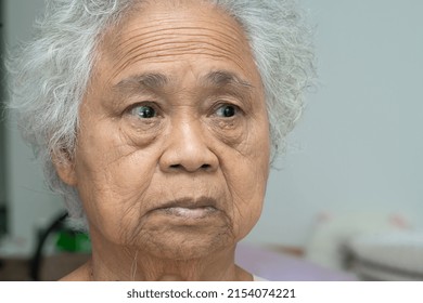 Asian Elderly Old Woman Face And Eye With Wrinkles, Portrait Closeup View.