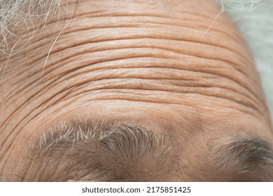 Asian Elderly Old Woman Face And Eye With Wrinkles, Portrait Closeup View.