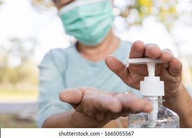 Asian elderly people wearing protective mask,using alcohol antiseptic gel,prevent infection,outbreak of Covid-19,senior woman washing hand with hand sanitizer to avoid contaminating with Coronavirus  