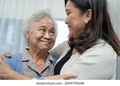 Asian Elderly Woman With Caregiver Walking With Happy.