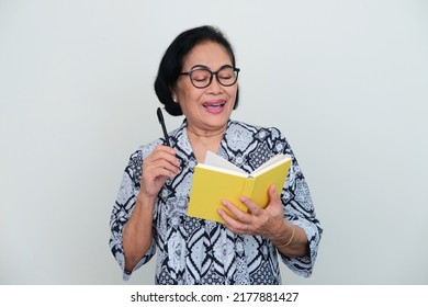 Asian elderly women showing happy expression when read a book