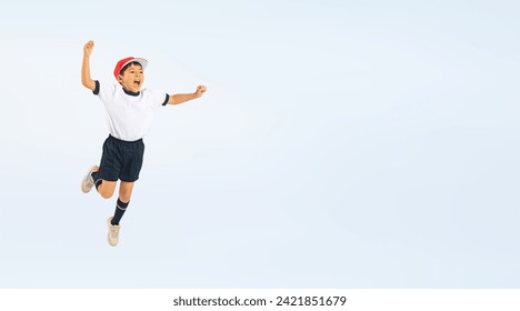 Asian elementary school boy jumping wearing gym clothes - Powered by Shutterstock