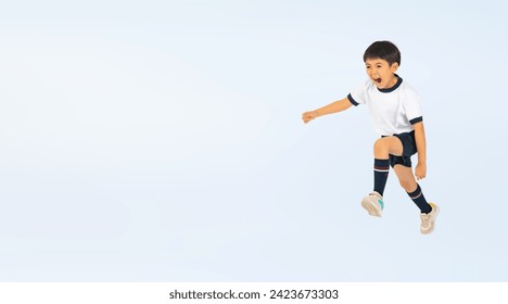 Asian elementary school boy jumping wearing gym clothes - Powered by Shutterstock