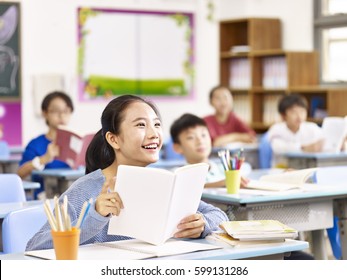 asian elementary school student smiling in class. - Powered by Shutterstock