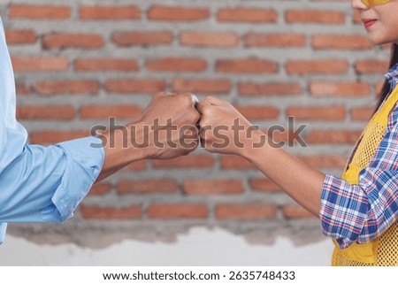 Asian engineer man brainstorming construction building contractor civil worker parners team meeting at constrcution site. Blueprint engineer hardhat worker helmet on table. Engineer teamwork consult