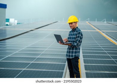 Asian engineer solar cell factory working with safety helmet outdoor