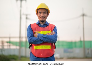 Asian Engineer standing outdoor on site construction posting confident , Engineer construction happy job success with in target planning  - Shutterstock ID 2183328937