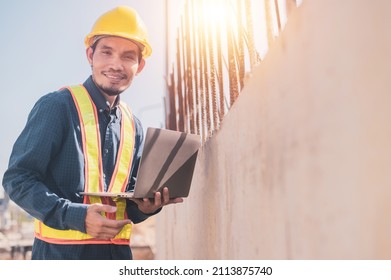 Asian Engineer Using Laptop Computer On Site Construction, Surveyor’s Computer At Construction Site 