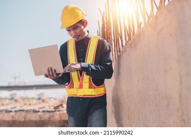 Asian Engineer Using Laptop Computer On Site Construction, Surveyor’s Computer At Construction Site 