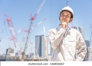 Asian Engineer Worker Working In Construction Site