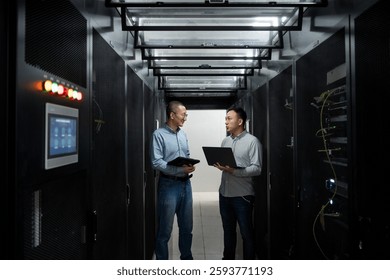 asian it engineer working in data center with laptop - Powered by Shutterstock - Get 15% off with code: PIKWIZARD15