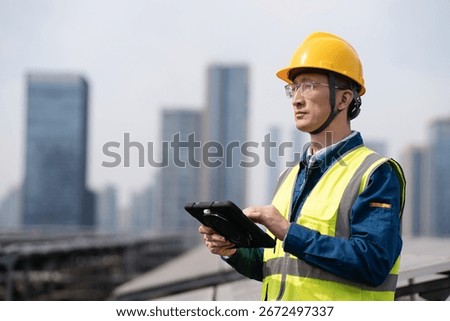 asian engineer working with digital tablet in solar power station