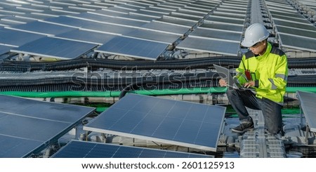 Asian engineer working at Floating solar power plant,Renewable energy,Technician and investor solar panels checking the panels at solar energy installation