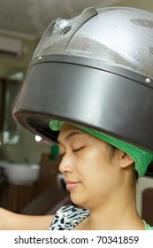 Asian Ethnic Young Woman Having Hair Steaming At Salon