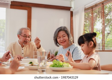 Asian Extended Family Having Breakfast Together At Home. Asian Big Family Grandparents Parents And Kid Enjoy Eating And Talking With Happy Moment.