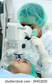 Asian Eye Doctor Examining A Patient