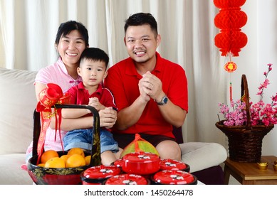 Asian Family Celebrate Chinese New Year.Chinese Characters In The Photo Means 