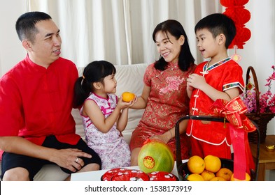 Asian Family Celebrate Chinese New Year.Chinese Characters In The Photo Means 