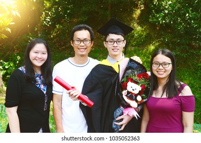 Asian Family Celebrate Graduation Outdoor For Family Member