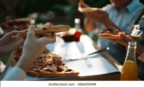 Asian Family Celebration Pizza Party Outside In The Backyard. Happy Family Having Festive Dinner Or Barbecue Party In Their Garden In Summer Holidays And People Concept. Family Lifestyle.