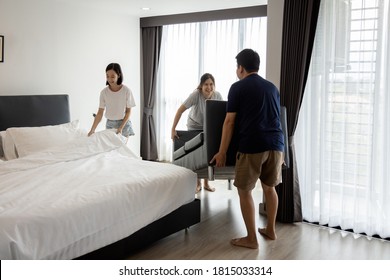 Asian Family Clean And Organizing The Room After Renovating,father And Mother Movers Carrying Sofa,child Girl Making Bed,enjoy The New Bedroom,stay At Home During The Coronavirus COVID-19 Pandemic