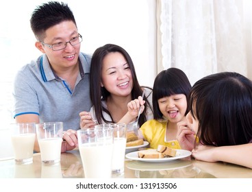 Asian Family Enjoying Breakfast